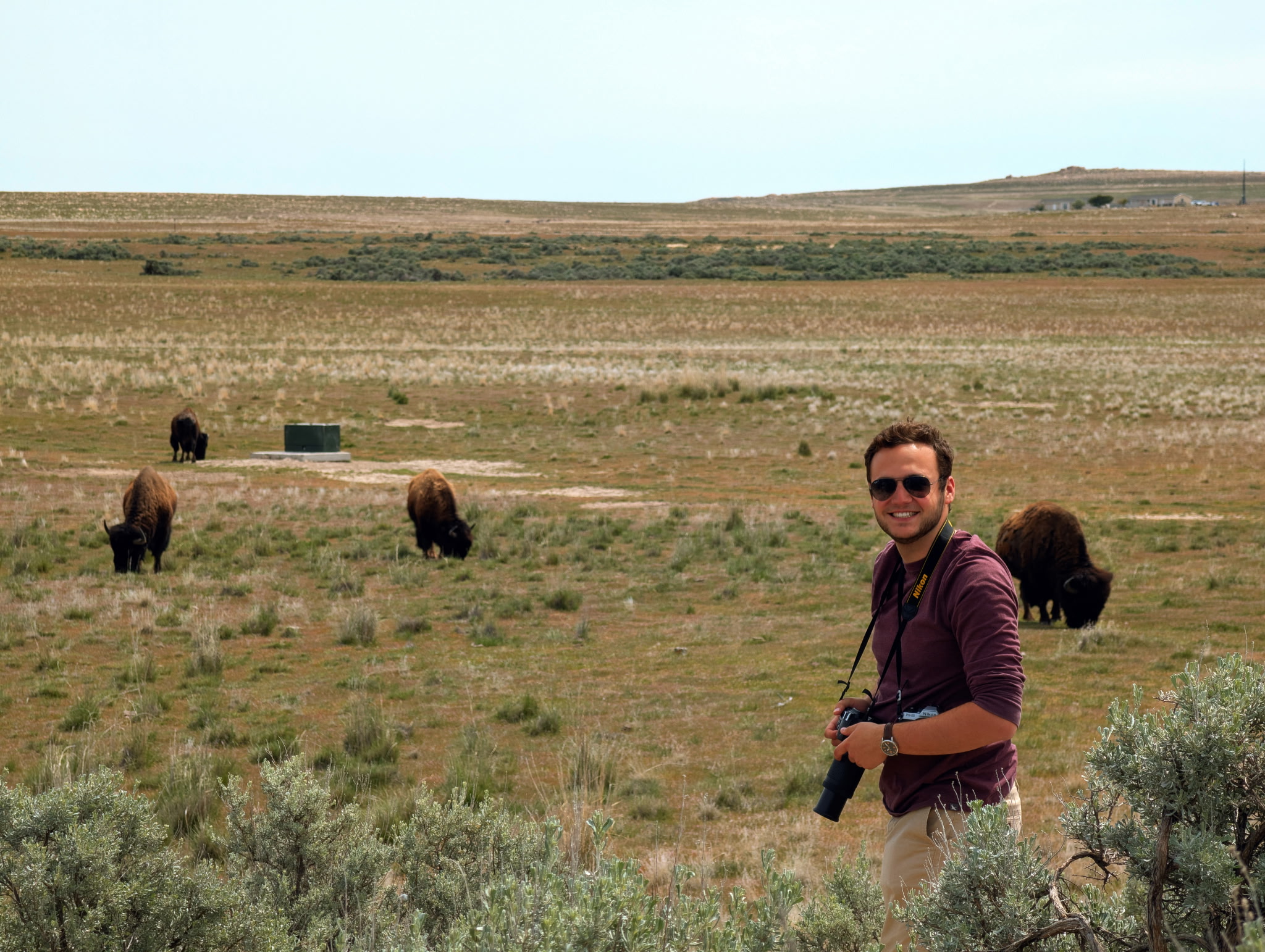 Joshua Sultanik outdoors with a camera