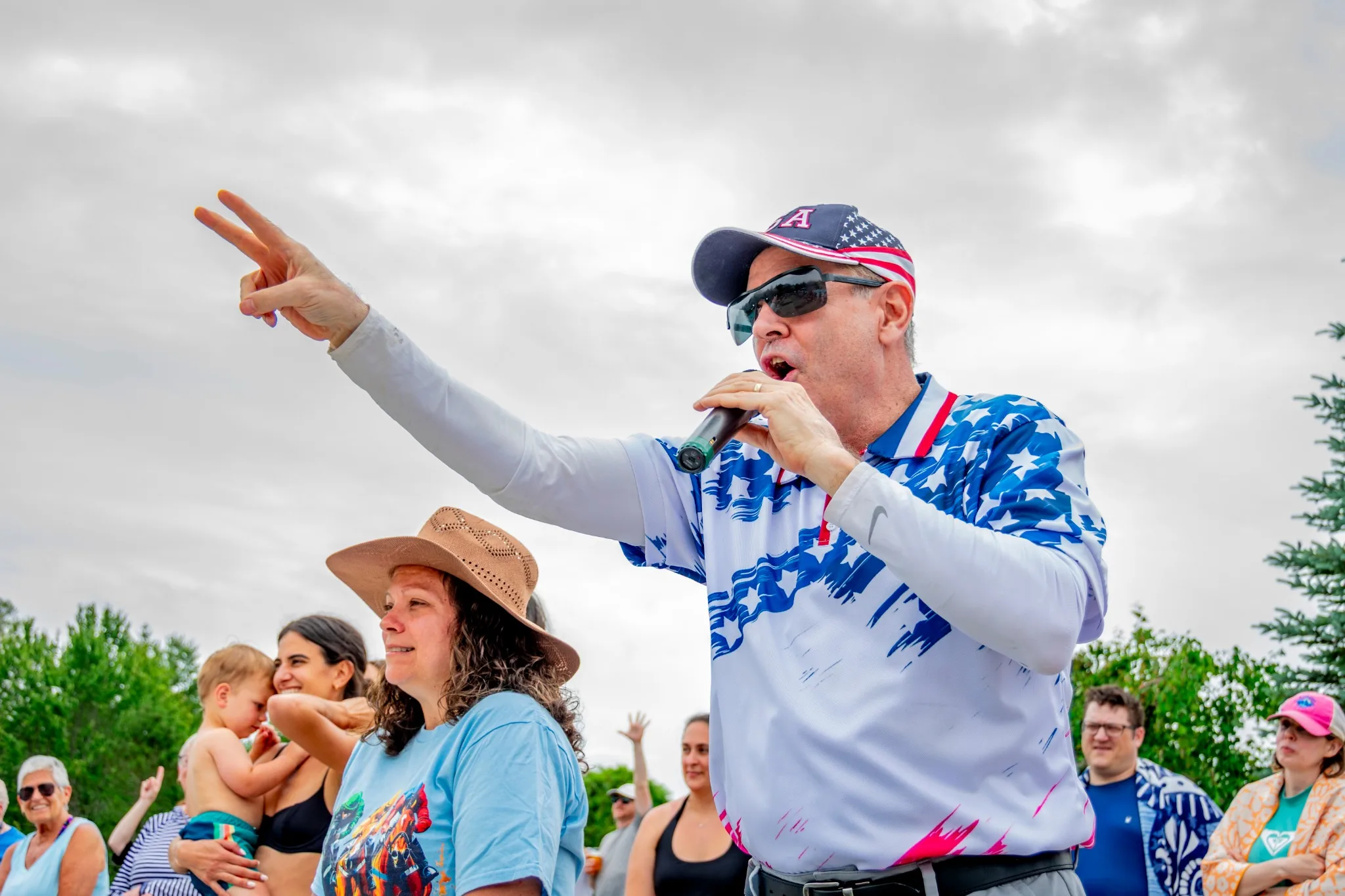 Sports announcer addressing a Lake Naomi crowd