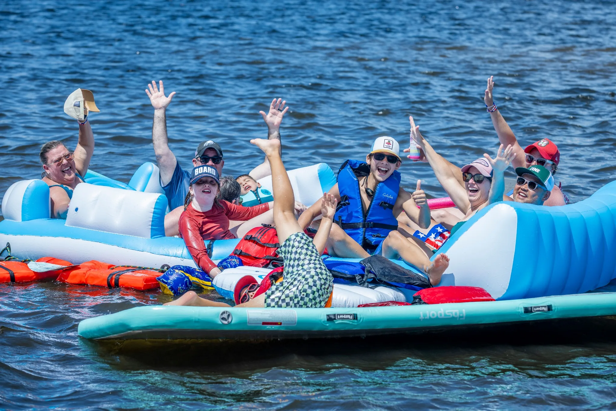 Lake Naomi community members celebrating together on the water