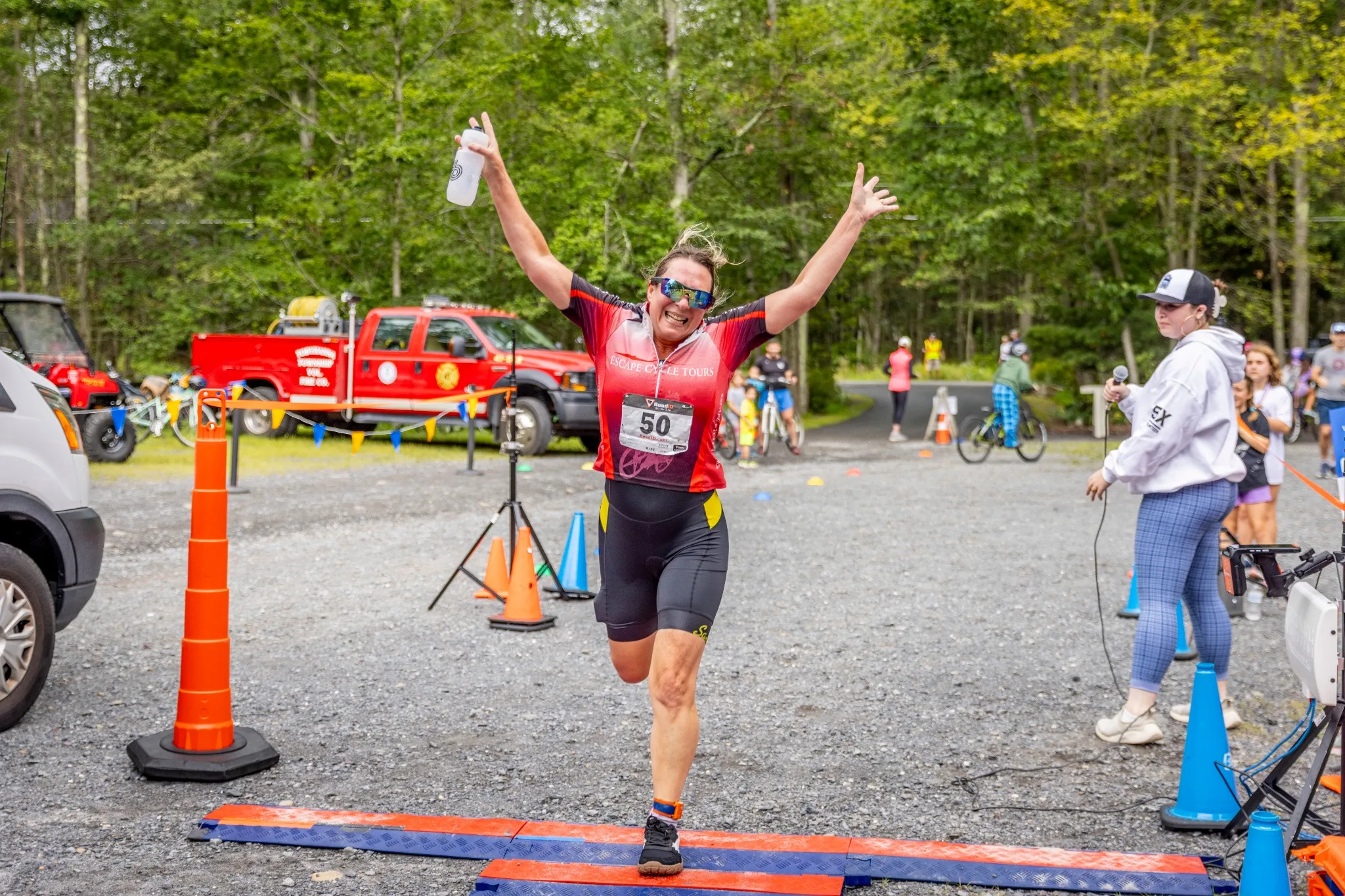 Athlete celebrating at the triathlon finish line
